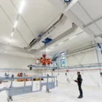 Handling of items in large environments by air